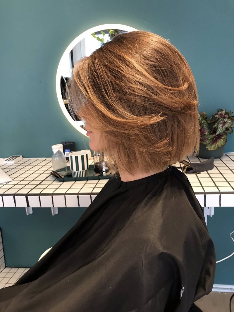 Copper bob with soft layers cut for movement, women's haircut in Copenhagen
